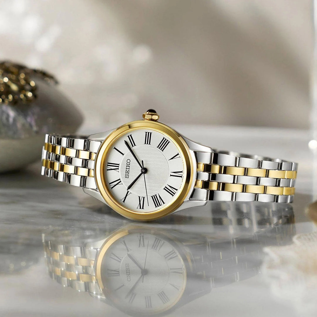 SEIKO LADIES QUARTZ WATCH – 29.6MM WHITE ROMAN NUMERAL DIAL SAPPHIRE CRYSTAL TWO-TONE STEEL BRACELET